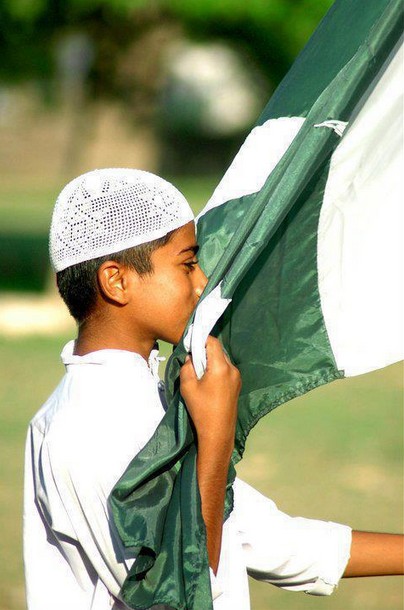 Pakistan-Flag-Lovers-A-little-boy-kissing-Pakistani-flag-Display-of-Pakistani-flag.jpg